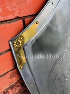 Metal shield with gold accents on a red brick background, branded 'Nautical Hub'.