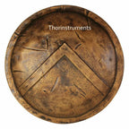 Bronze-colored circular object with a design, branded 'Thorinstruments'.