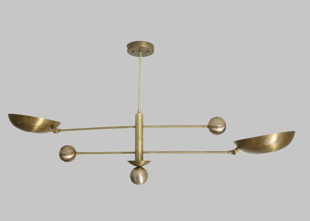 Brass chandelier with five arms on a gray background