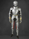 Full suit of medieval armor on a dark background
