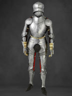 Full suit of medieval armor on a dark background