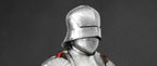 Person wearing a detailed medieval armor helmet on a dark background