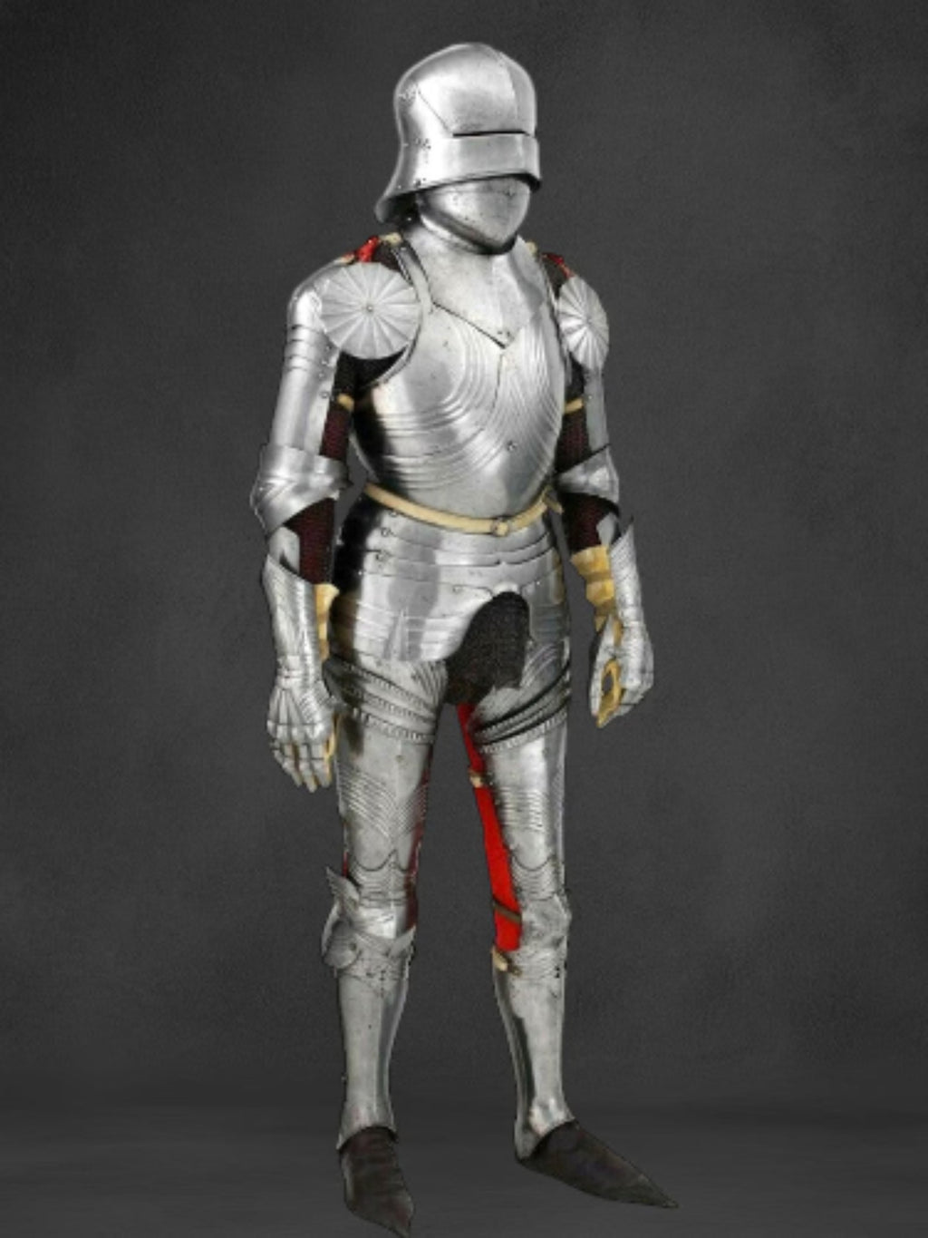 Full suit of silver armor on a dark background