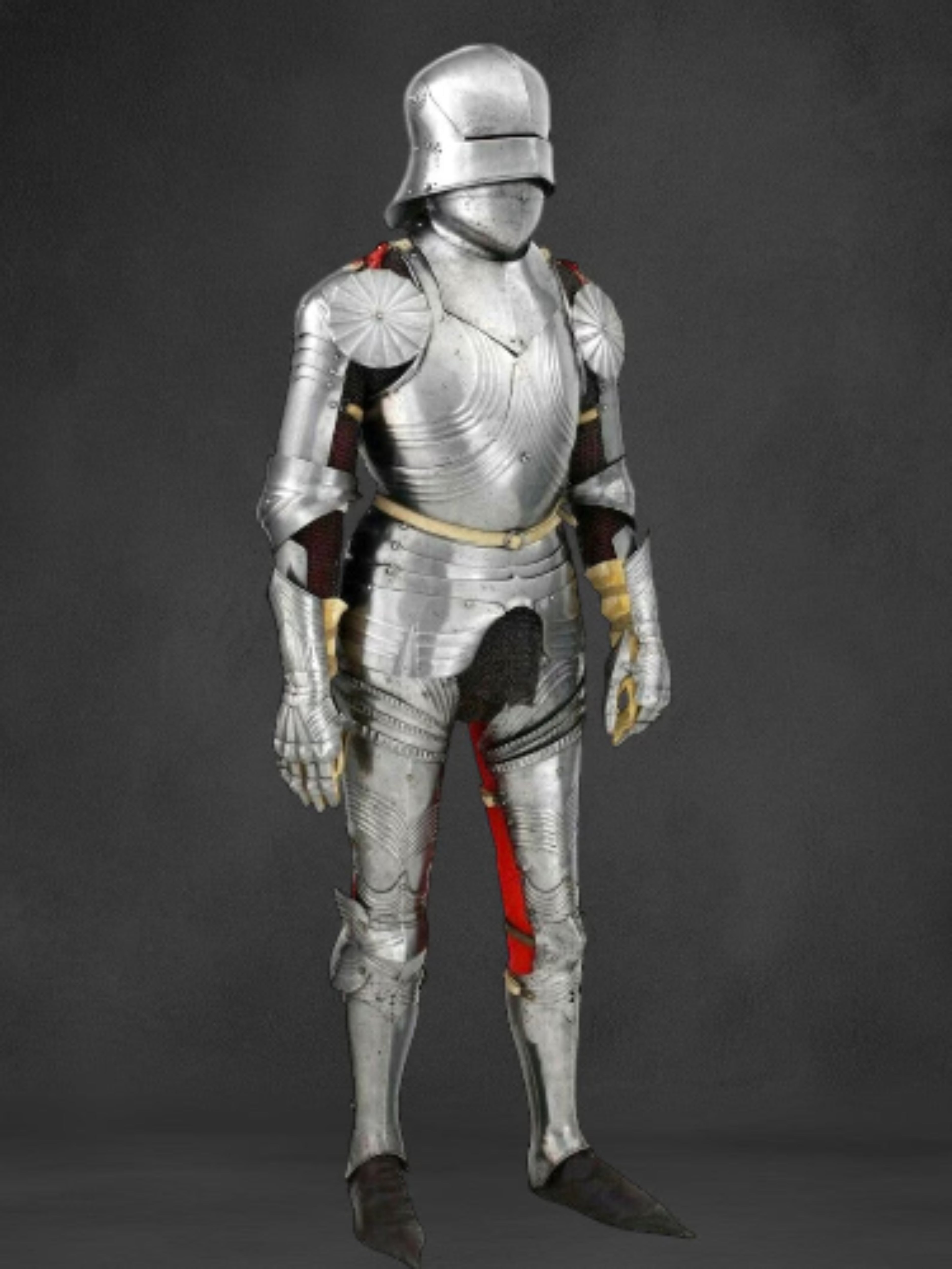 Full suit of silver armor on a dark background