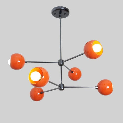 Modern chandelier with orange and white spherical lights on a gray background