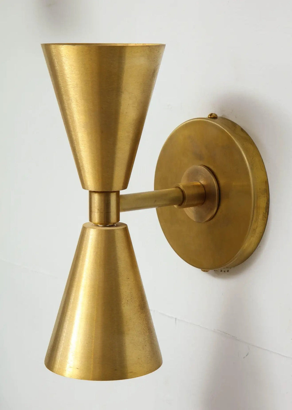 Gold wall sconce on a white background