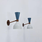 Pair of wall lights with blue and white design on a light gray background