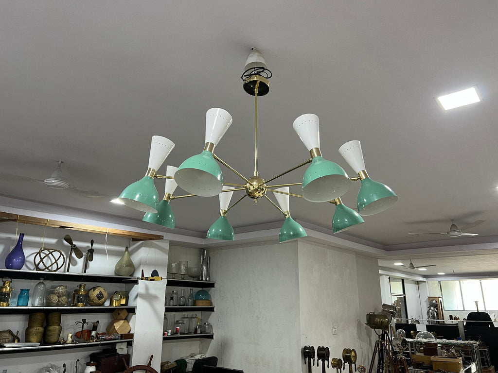Modern chandelier with green and white design in a room setting