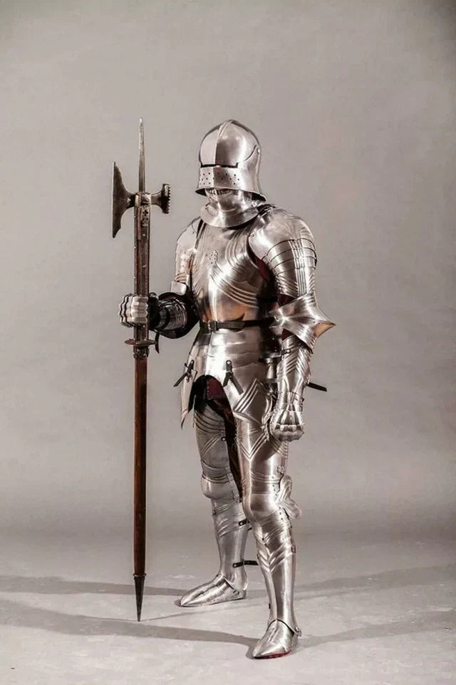 Full suit of medieval armor with a spear on a neutral background